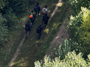 Grupa migrantów po bialoruskiej stronie granicy 